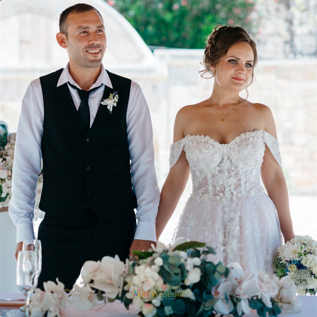 Newlyweds holding hands during the ceremony