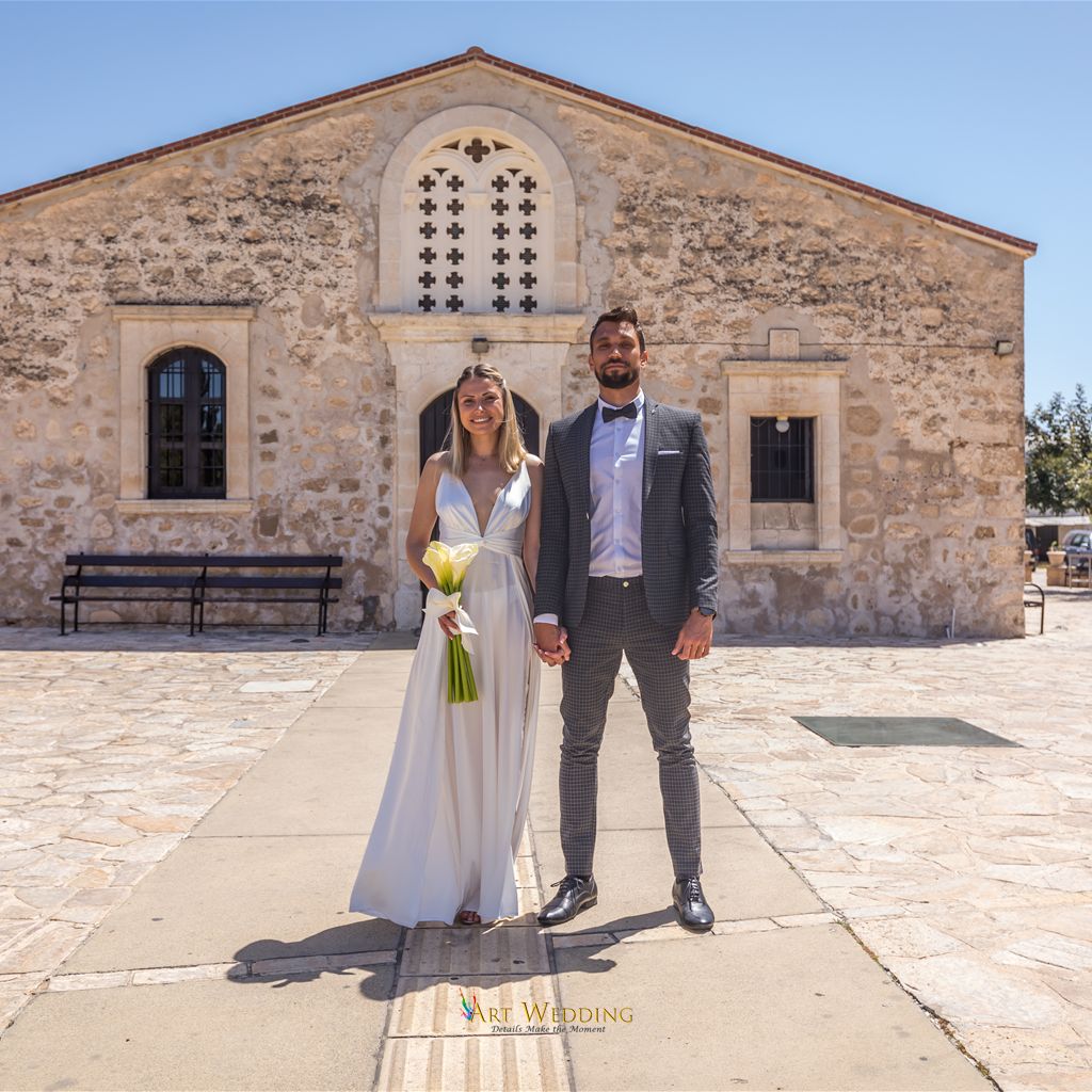 Wedding portrait by an old stone building