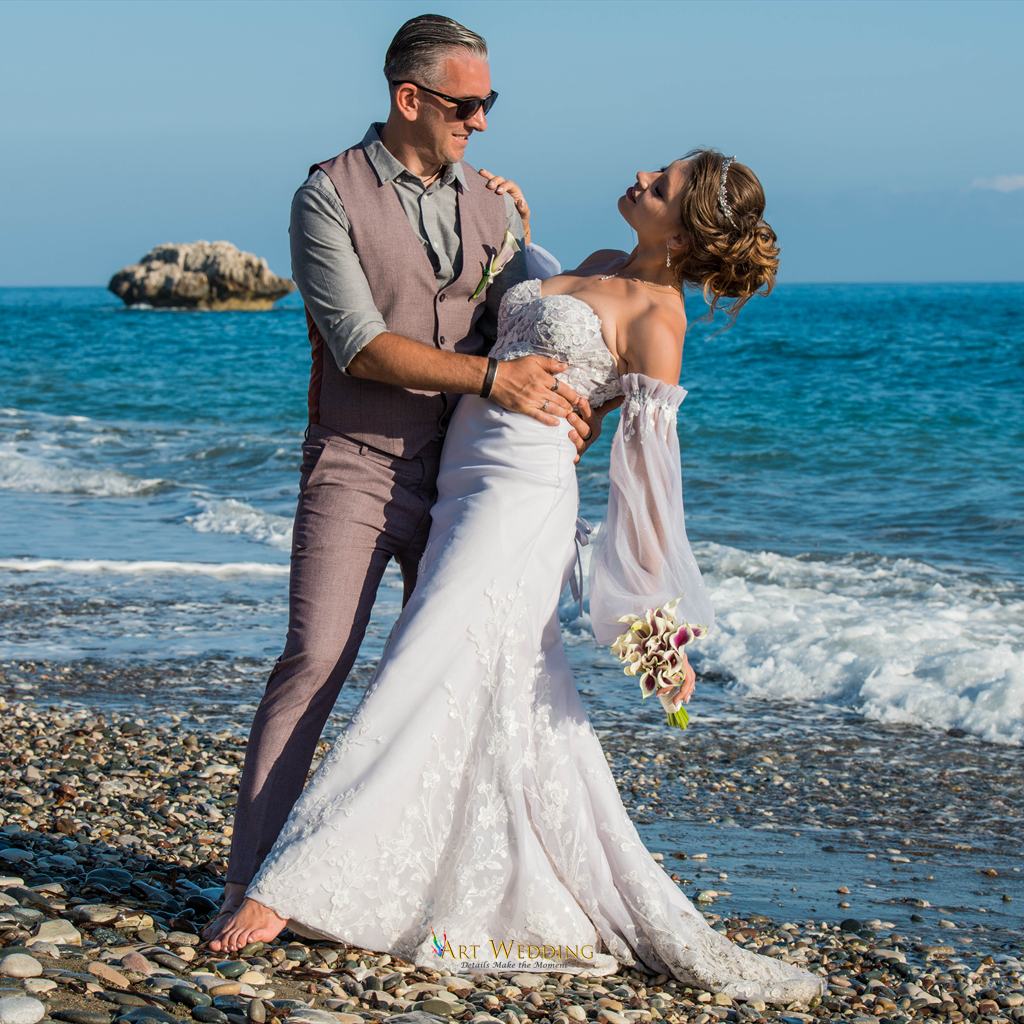 Romantic wedding portrait at the water’s edge