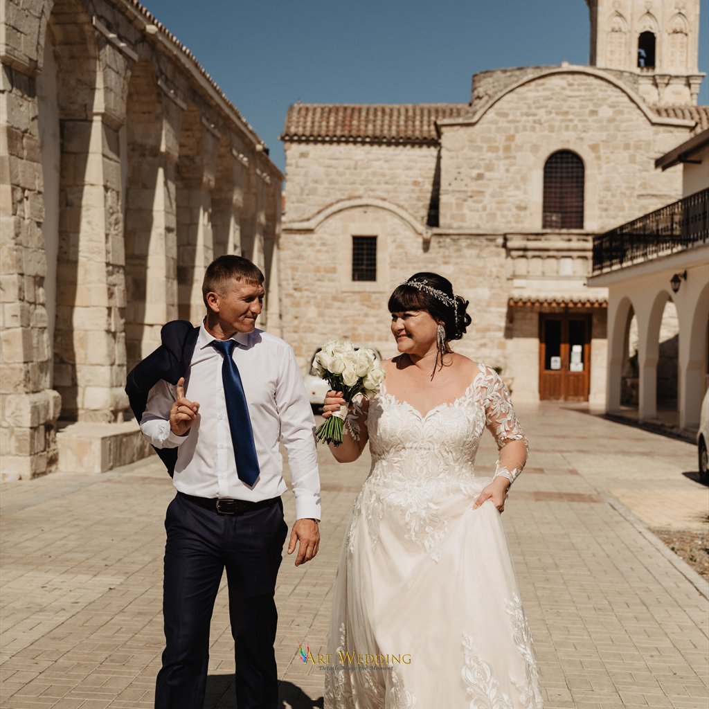 Wedding walk beside a stone church in Larnaca