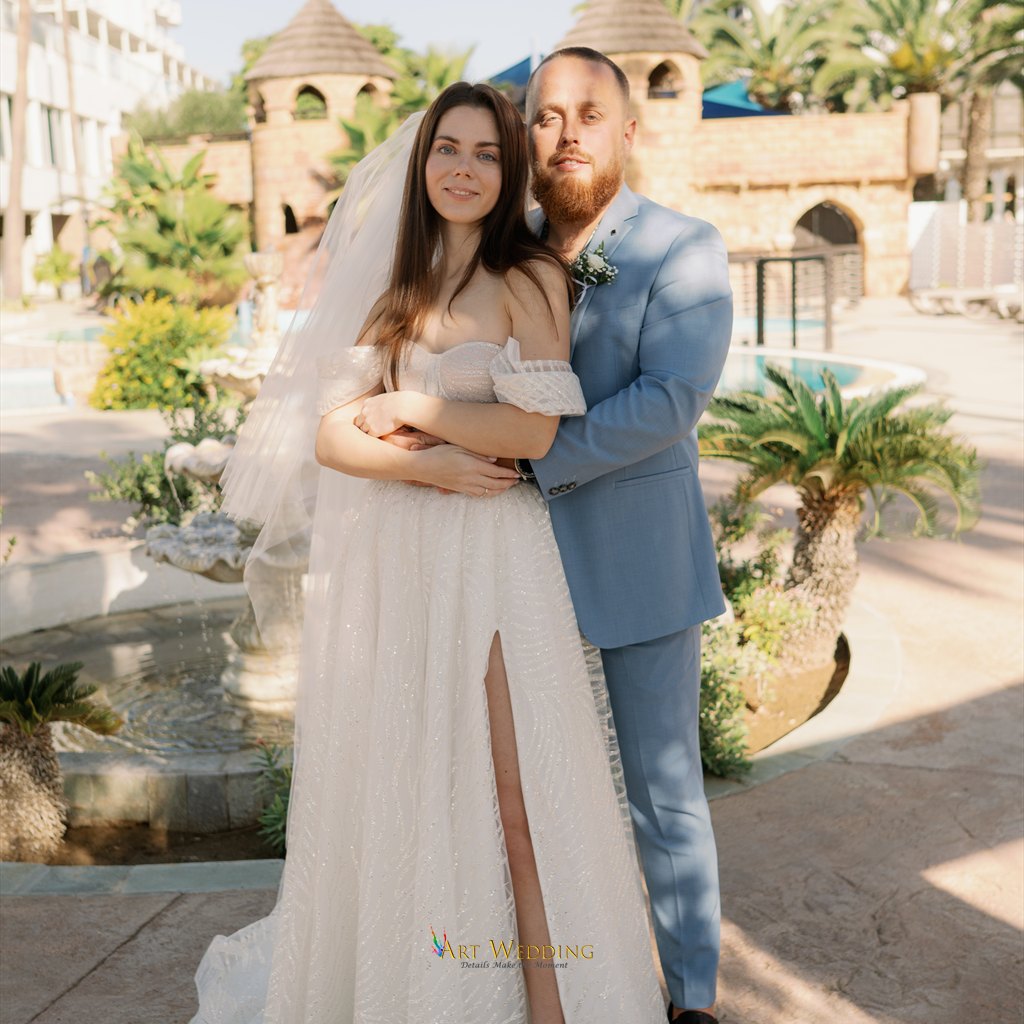 Wedding portrait of a couple in a garden