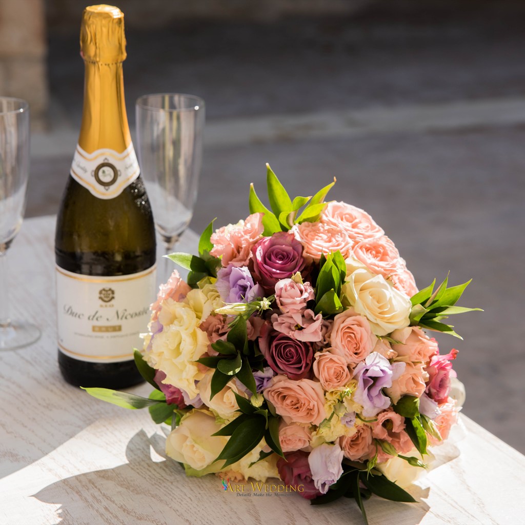 Bridal bouquet and champagne on the table