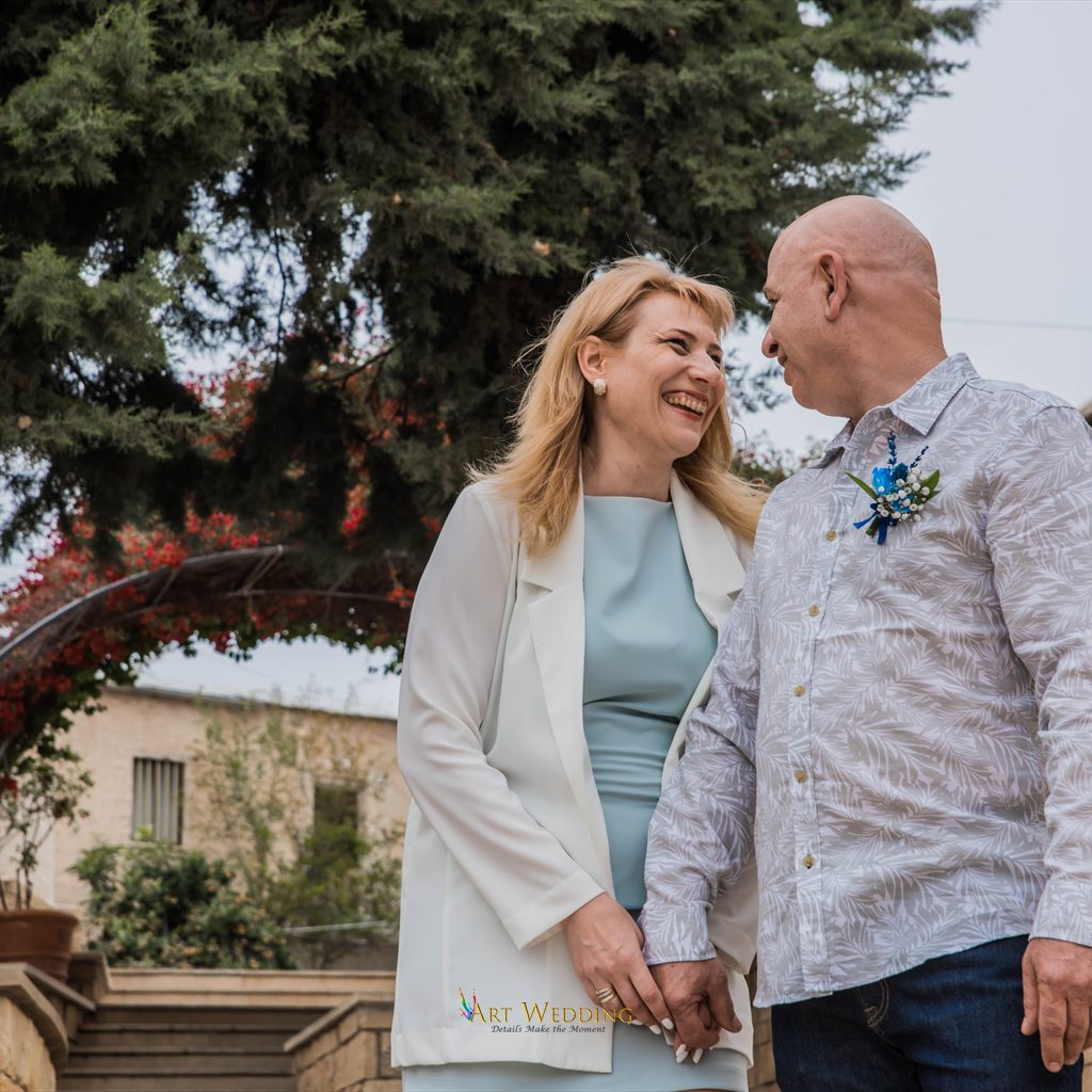 Newlyweds smiling in the garden