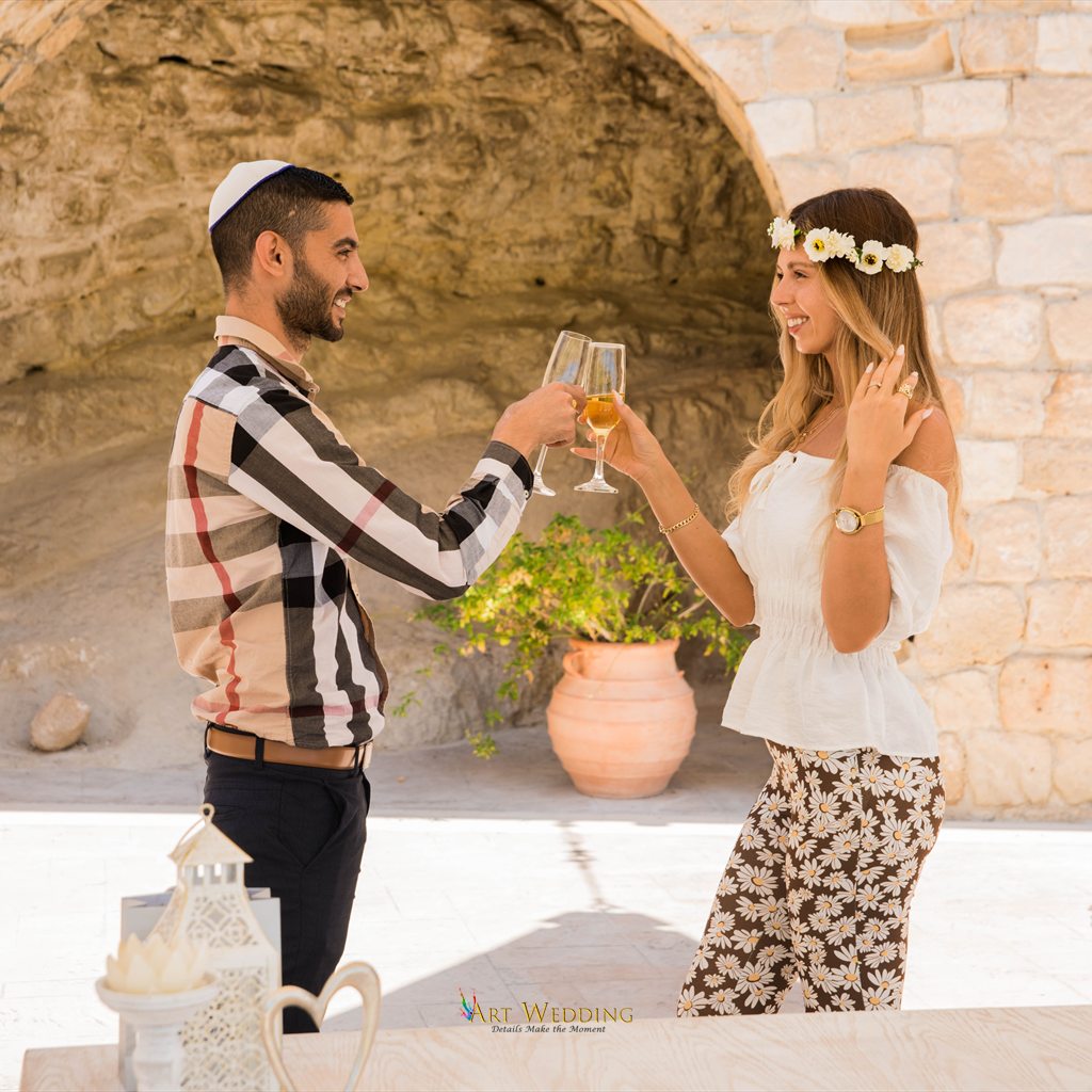 Wedding toast beneath a stone arch