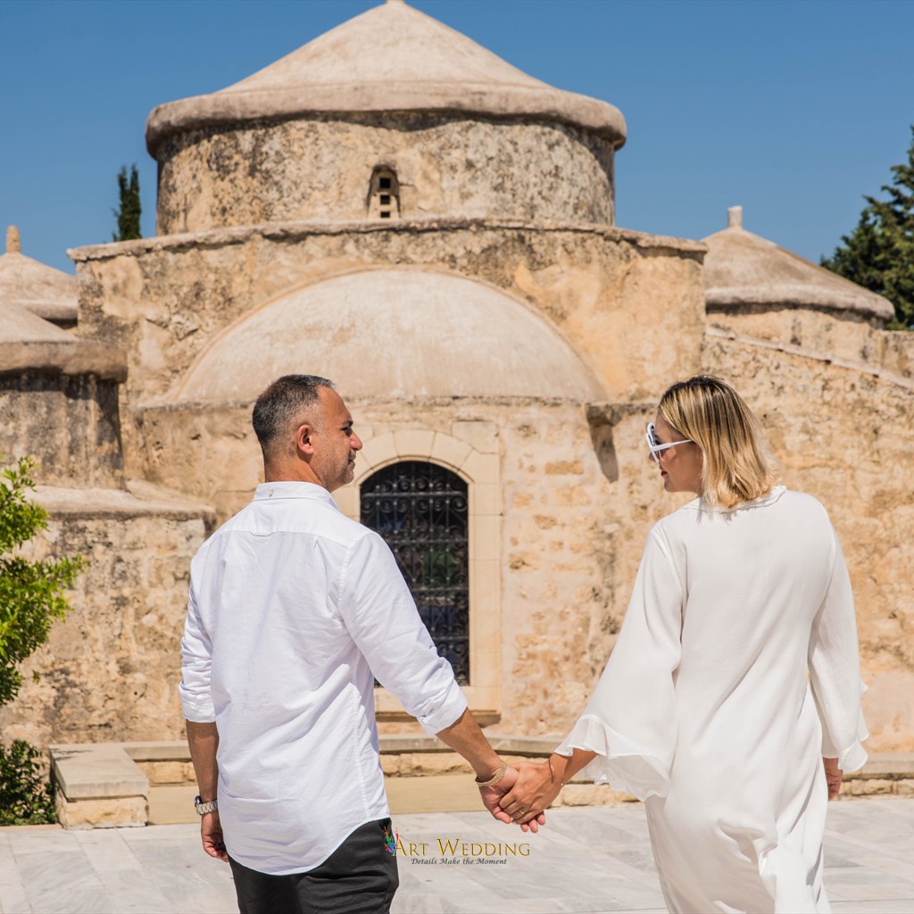 Couple’s wedding walk by a stone church