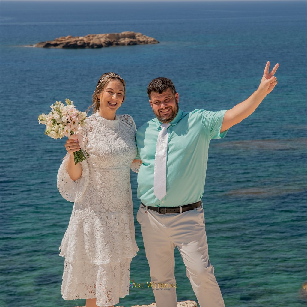 Wedding portrait of a couple by the sea
