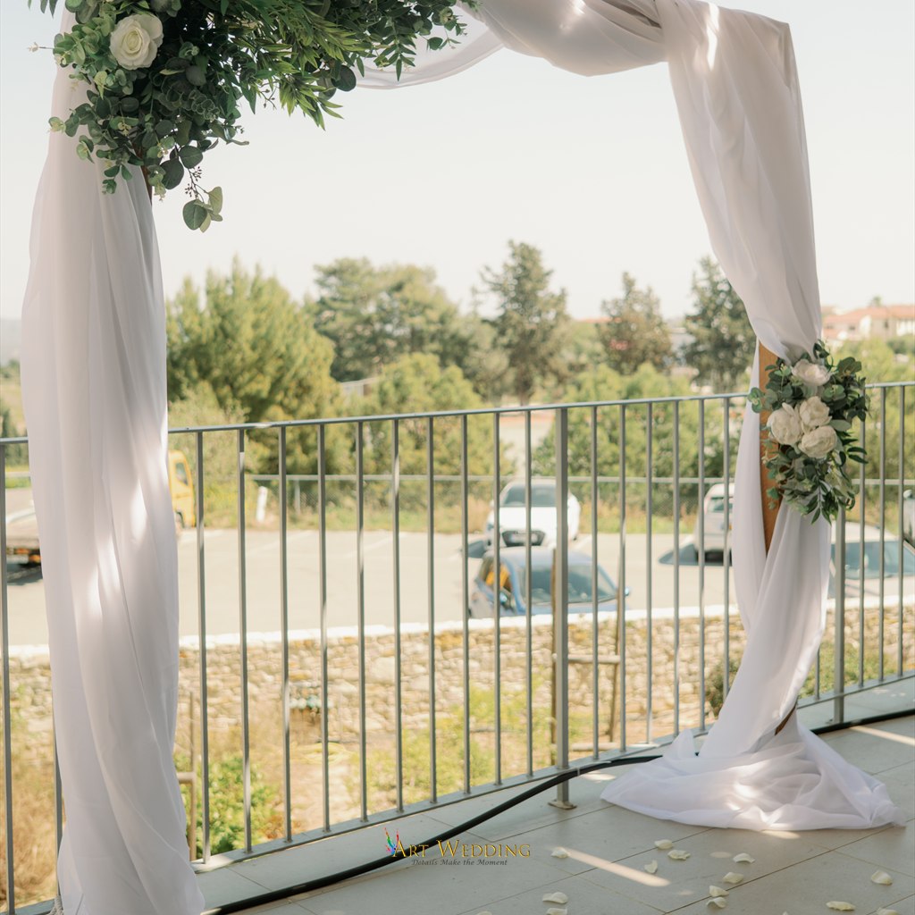 Wedding arch with white draping on the terrace — Lefkara, Cyprus