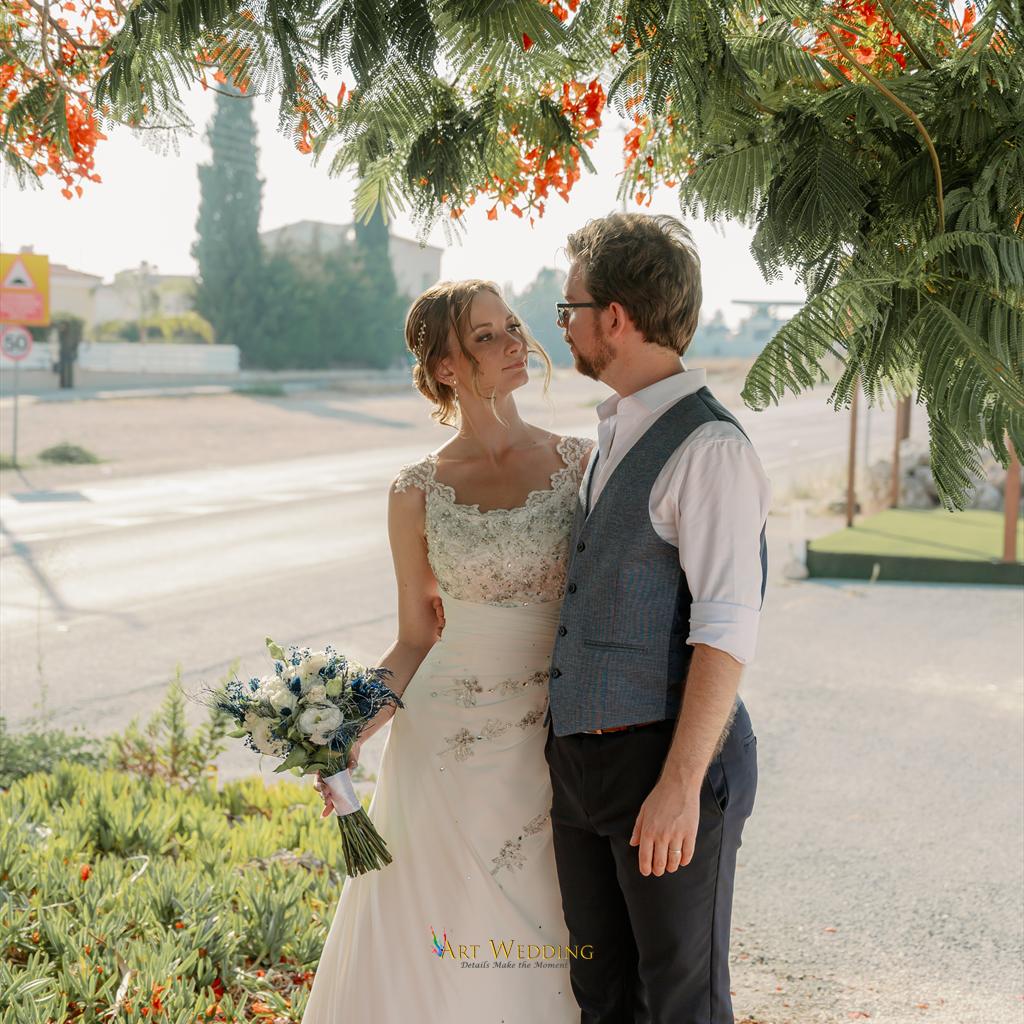 Wedding portrait beneath flowering branches