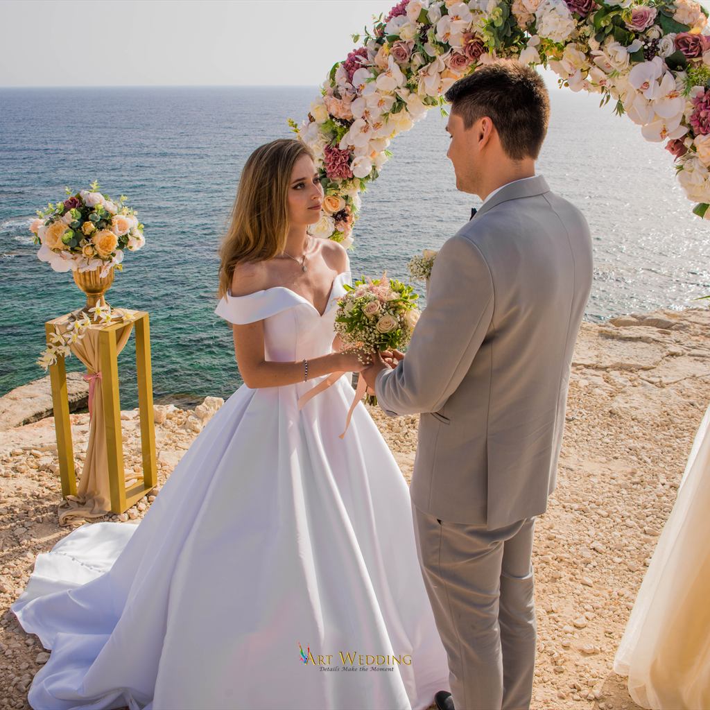 Bride and groom during their seaside ceremony