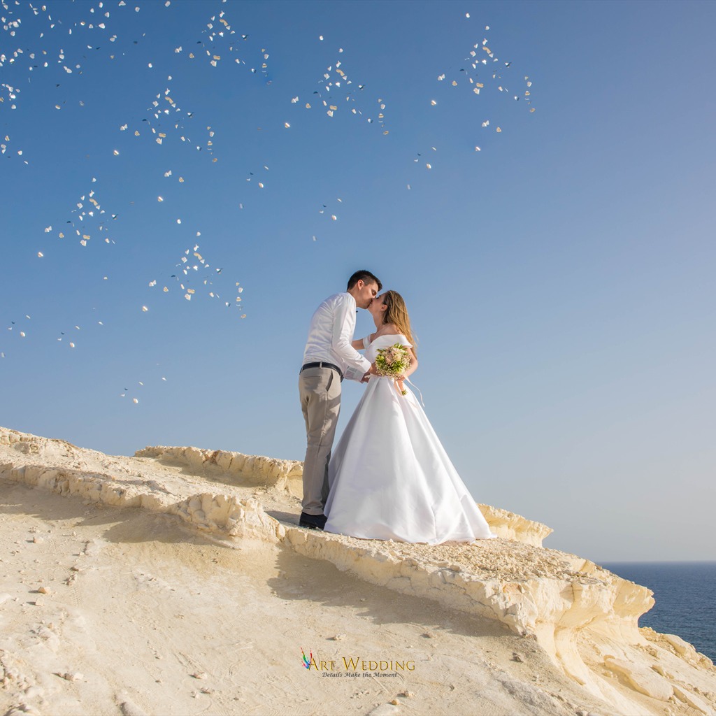 Wedding petals against the sea and white cliffs