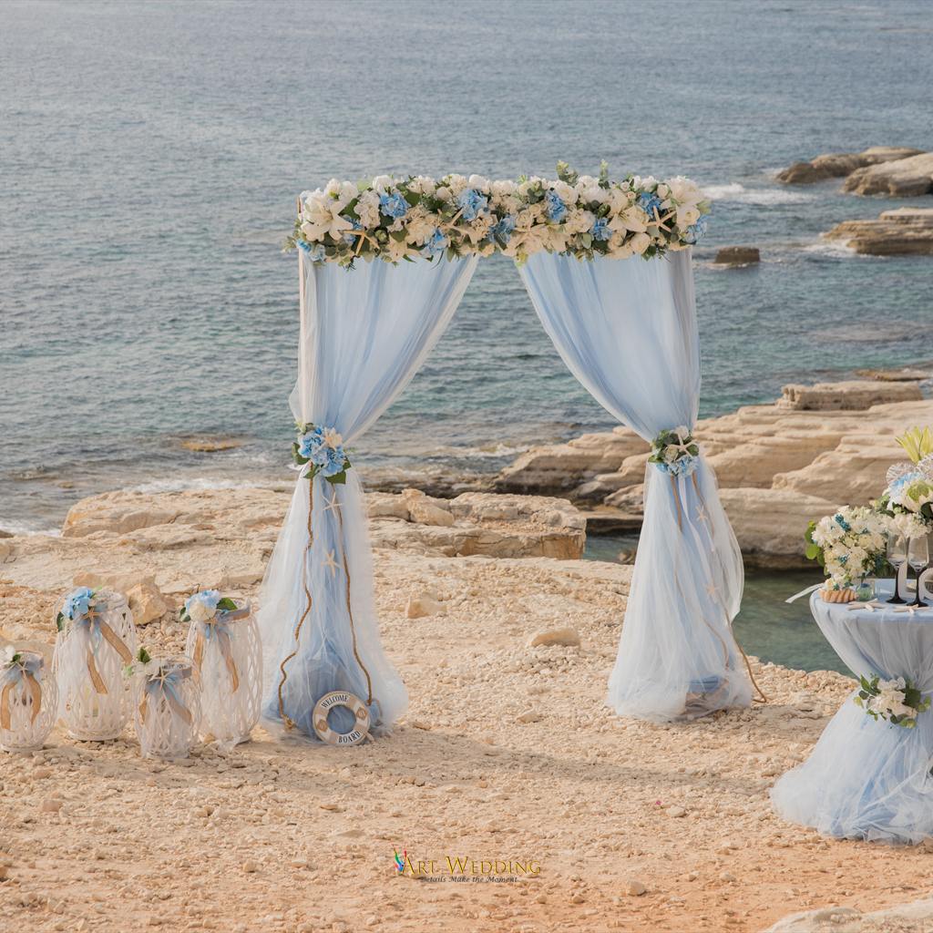 Floral arch and ceremony decorations by the sea